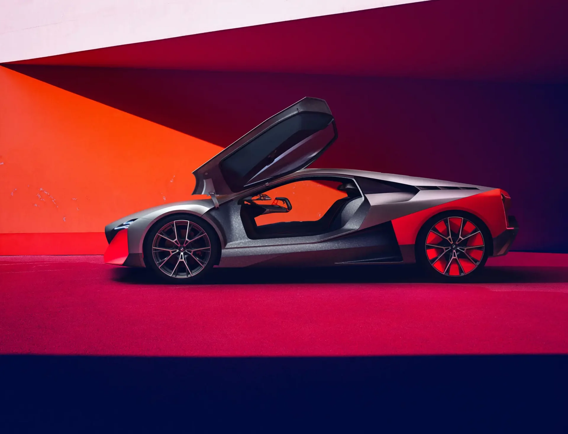 A side shot of a sports car rendering. The door is open