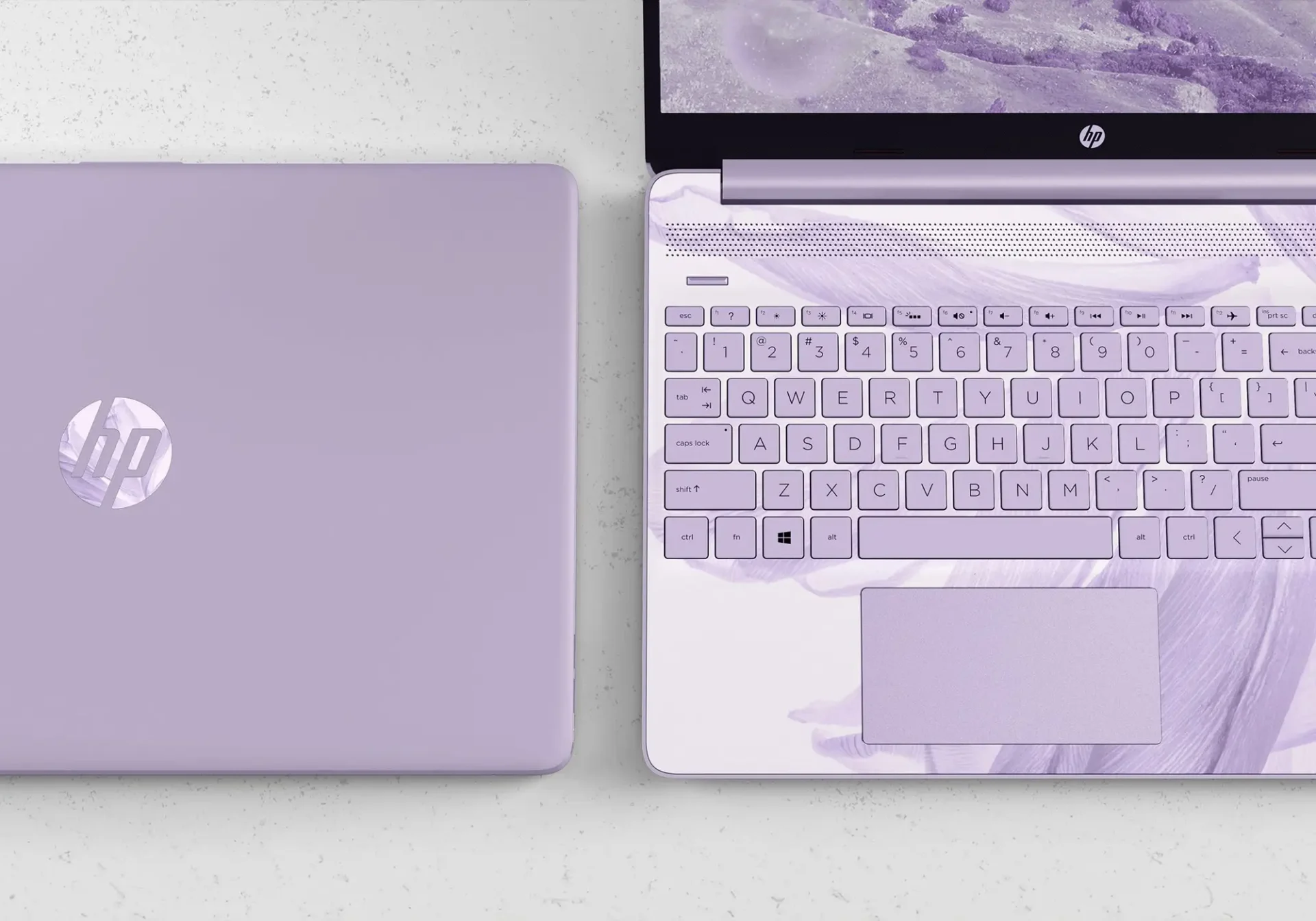 A laptop and keyboard panel design featuring a wash of blues and purples