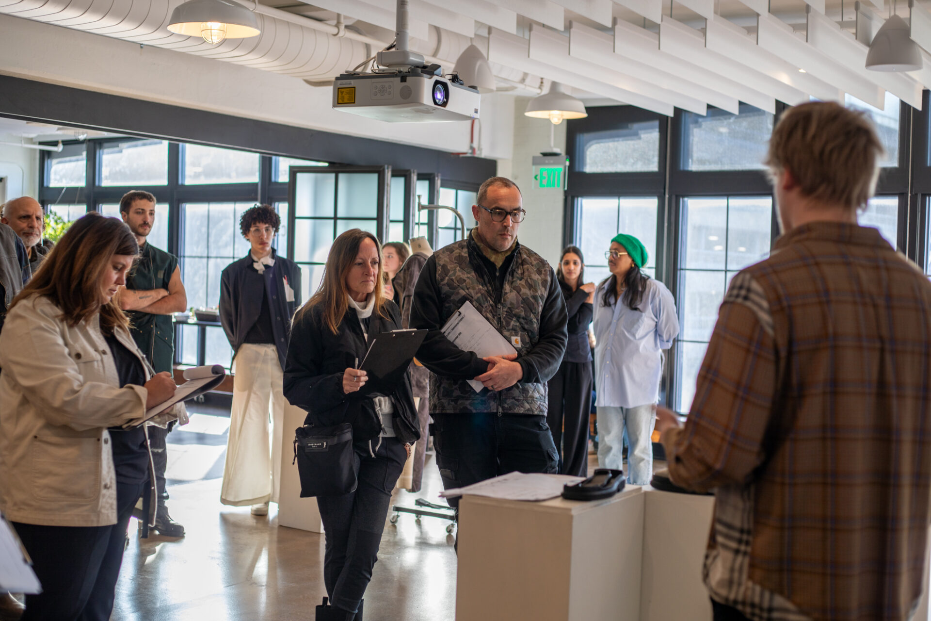 Carhartt designers review student final student work set up at the Carhartt store in Detroit.