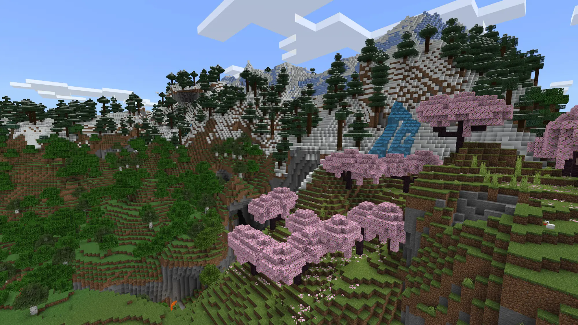 A nature scene depicting mountains, trees and greenery, built in blocks