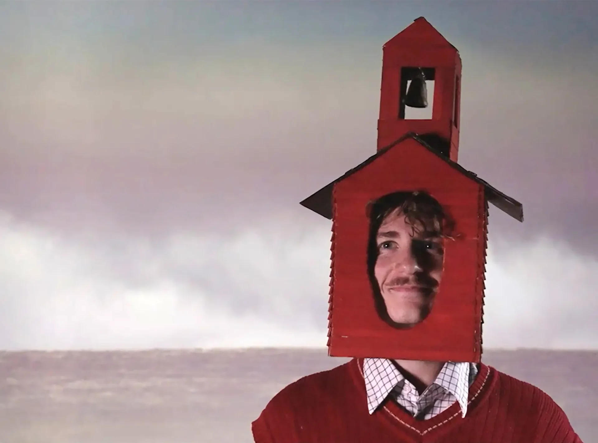 Film still from "Two for Desire"—closeup of the schoolhouse as it falls in love.
