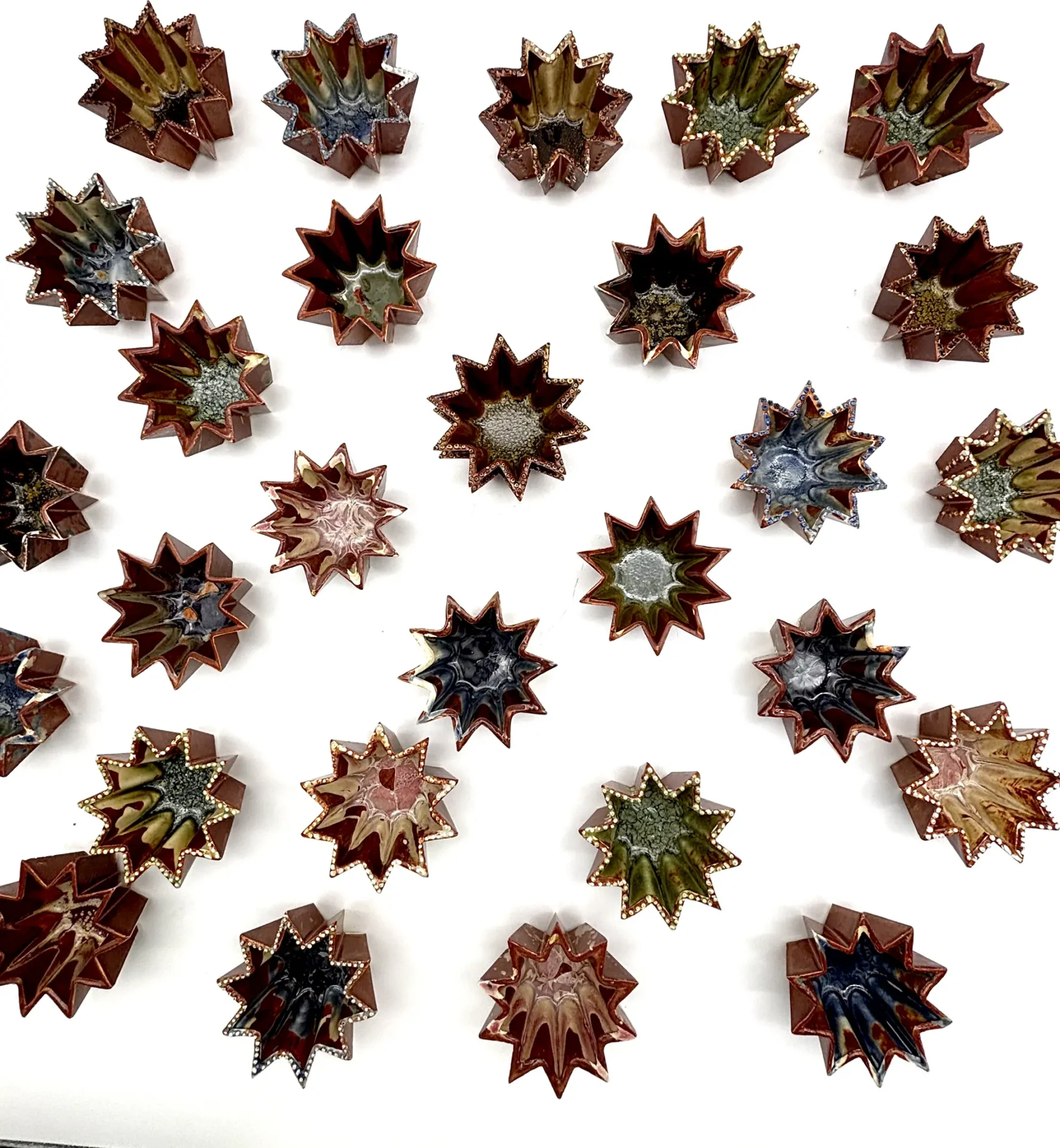 A field or starburst-shaped ceramics from production course.