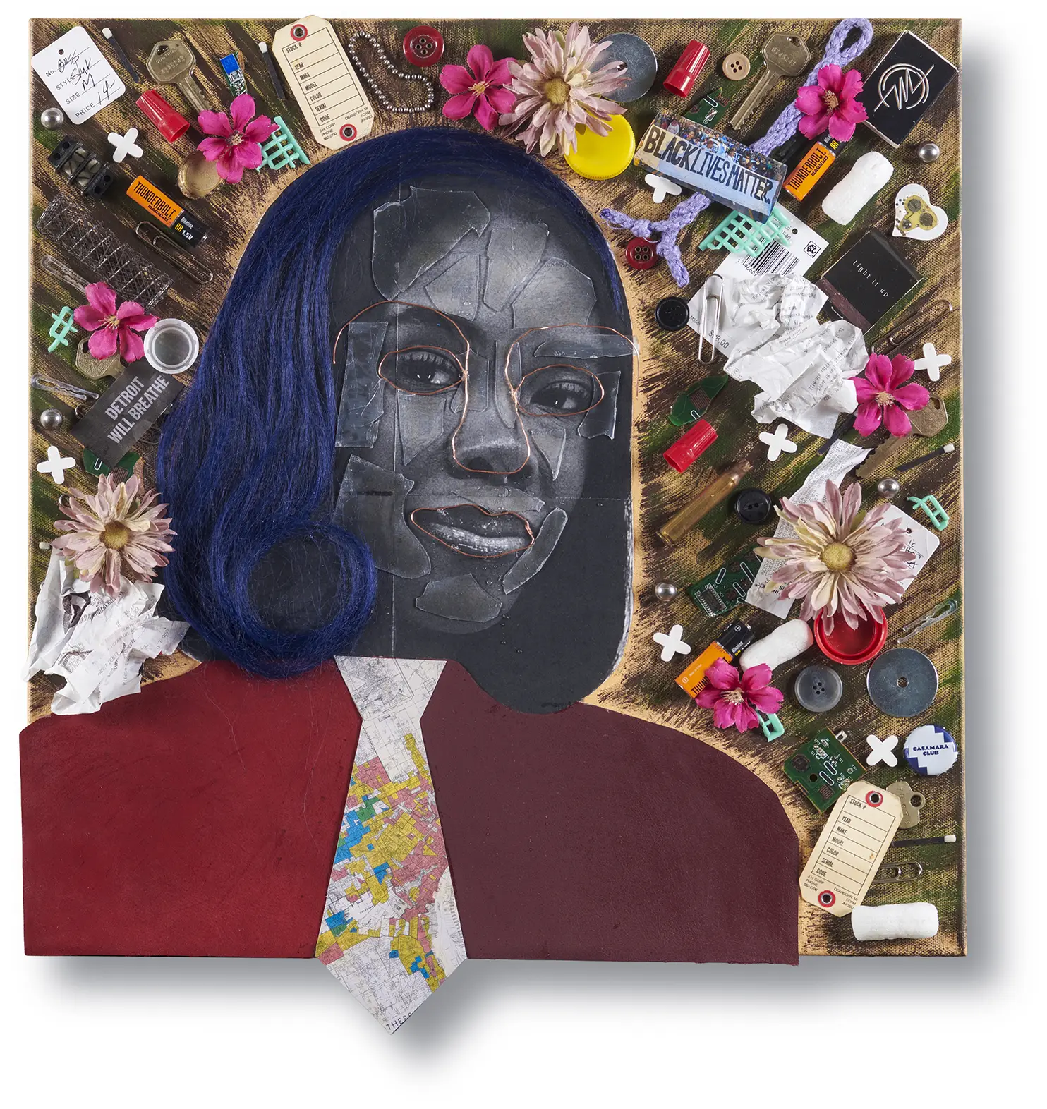A canvas, layered with paint, cutouts and materials to create a portrait of a woman