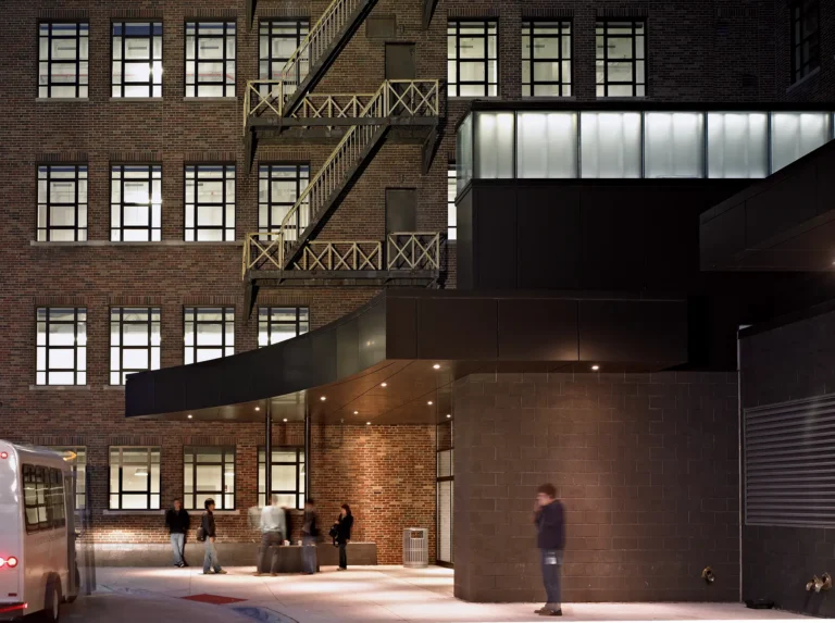 An exterior shot of the entrance of the Taubman Center at night