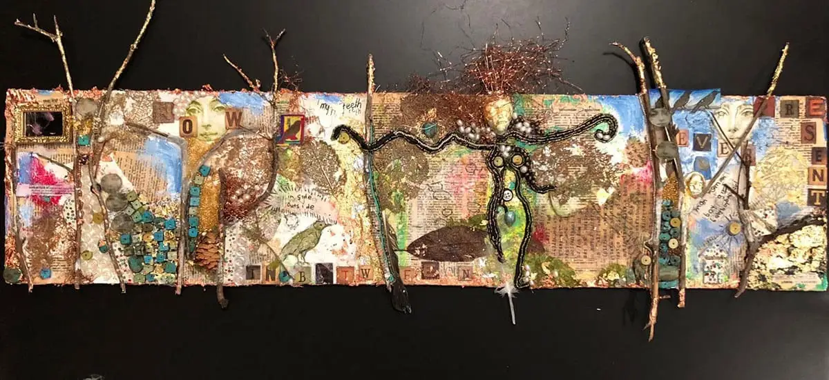 A mixed media collage using pages from books, twigs, buttons, beads, paint and leaves by Amy Ruopp.