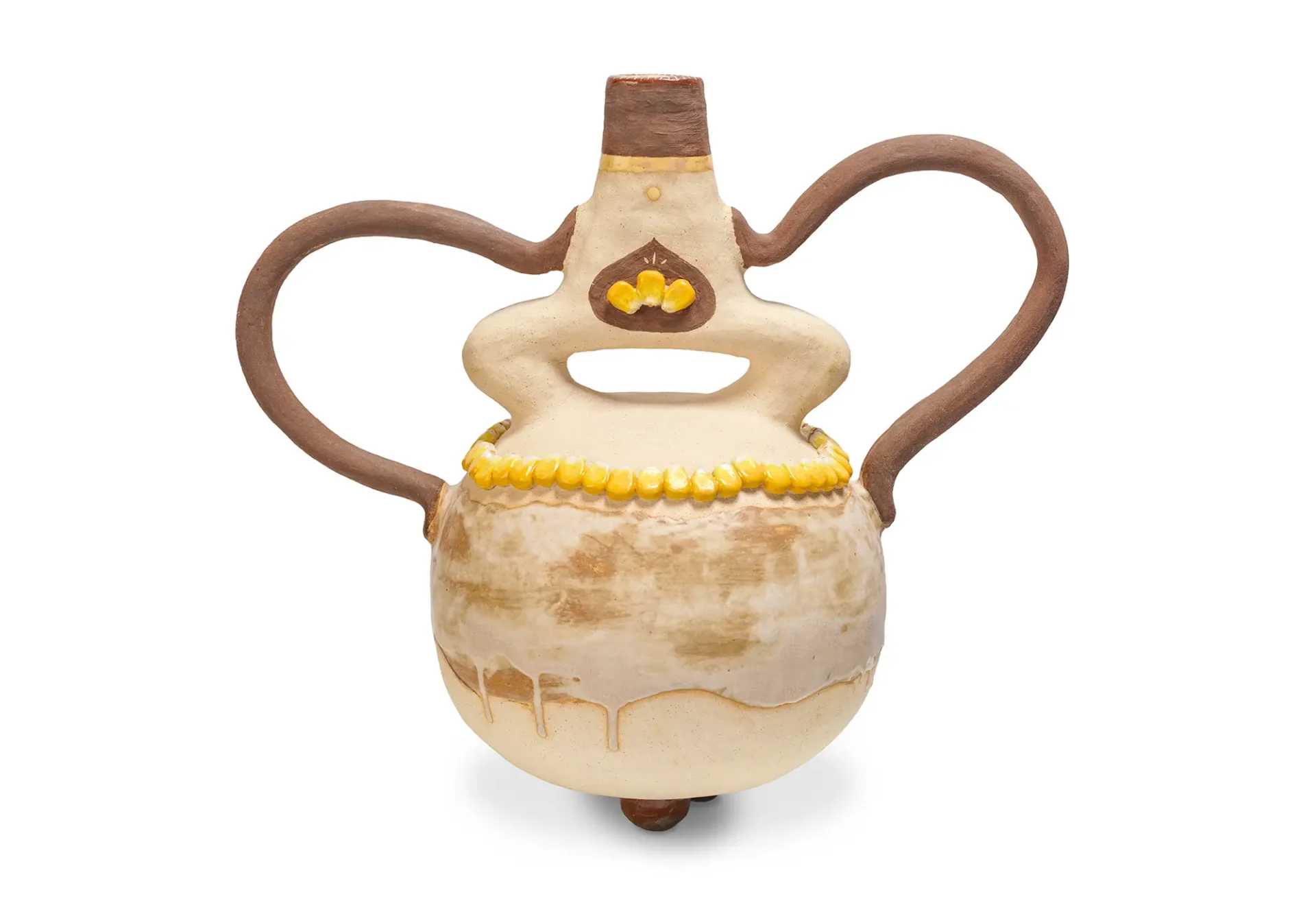 Round piece with brown handles, and corn
