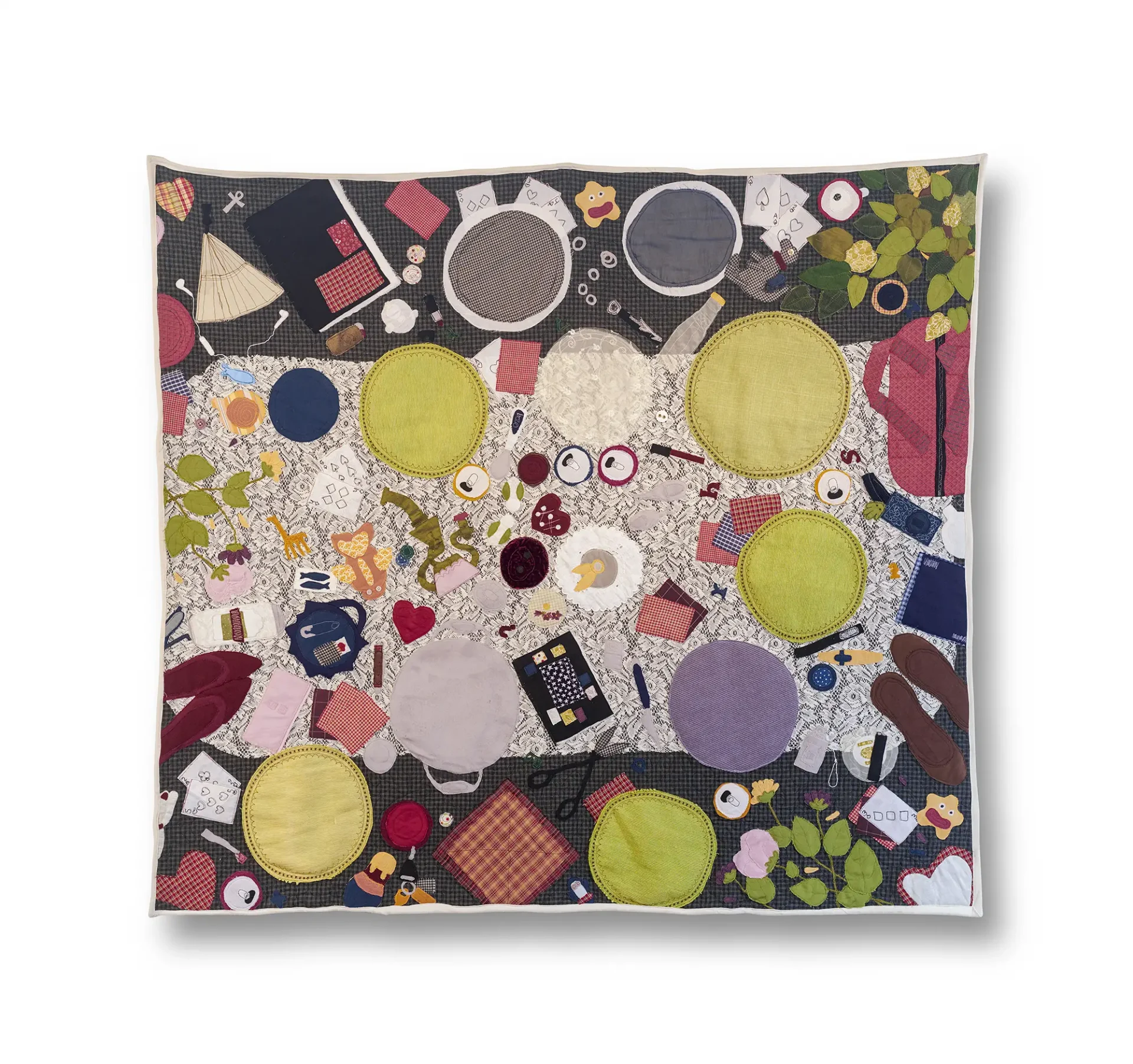 A full sized quilt with applique items placed all around the front, quilted back and white border