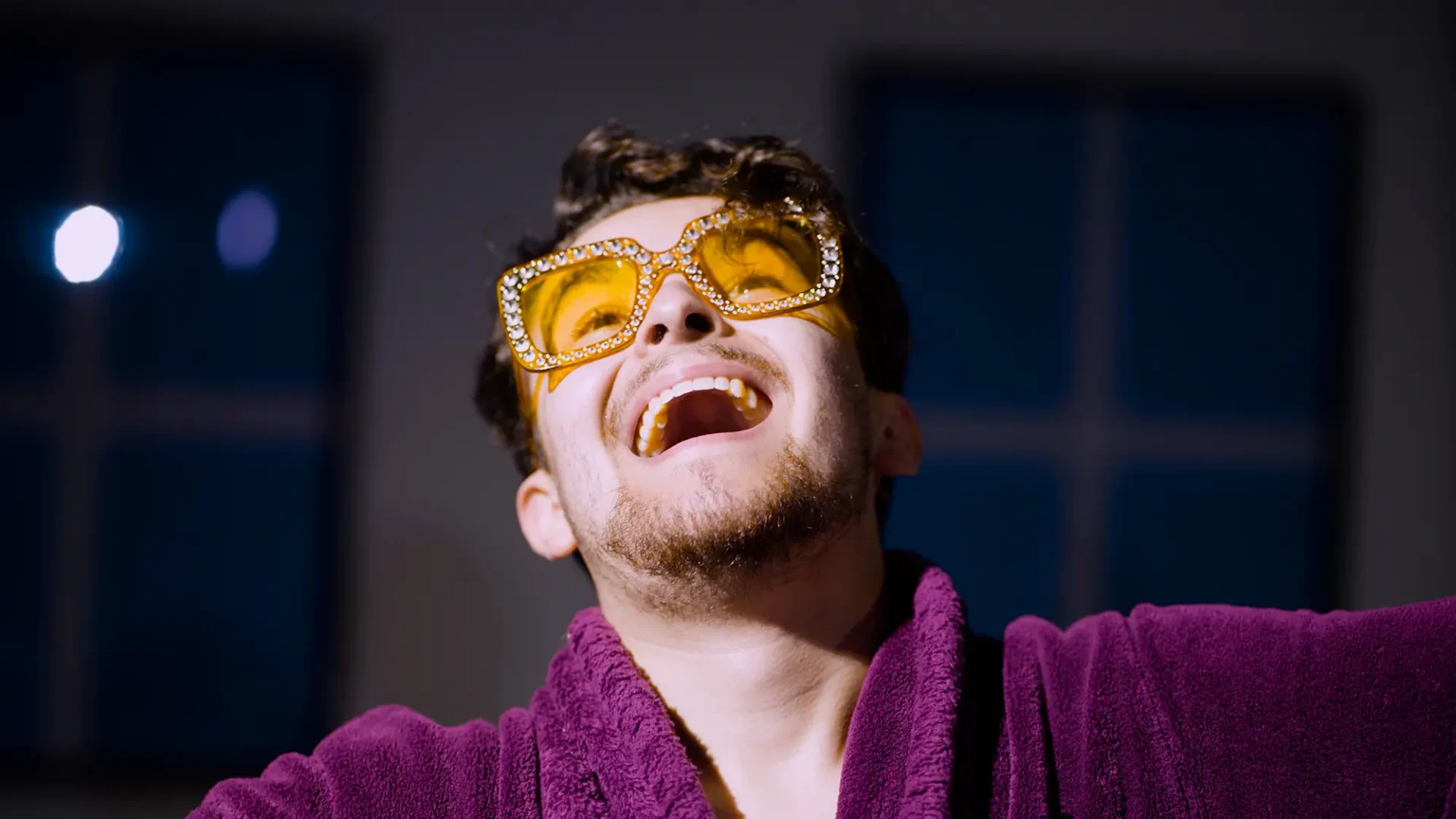 Film still: Close-up of the self-satisfied dancer at the end of the program.