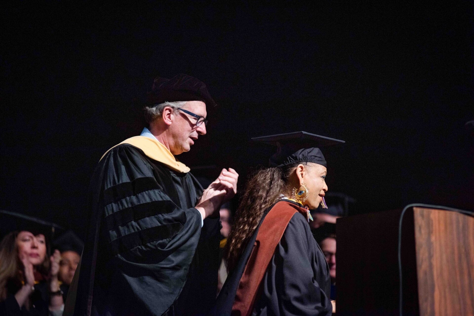 Sabrina Nelson receives recognition onstage during the CCS commencement ceremony.