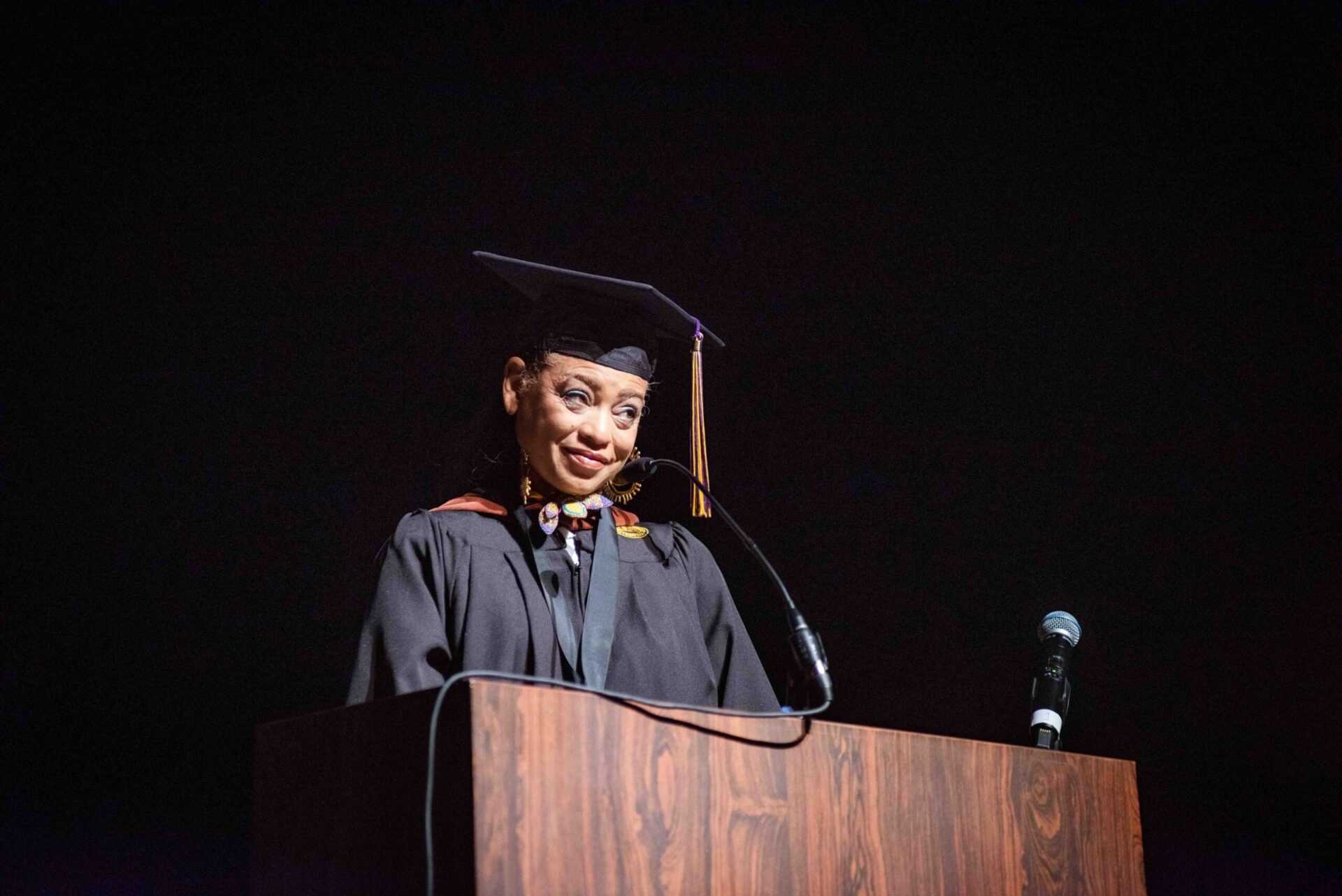 Sabrina Nelson speaks at a podium during the CCS commencement ceremony.
