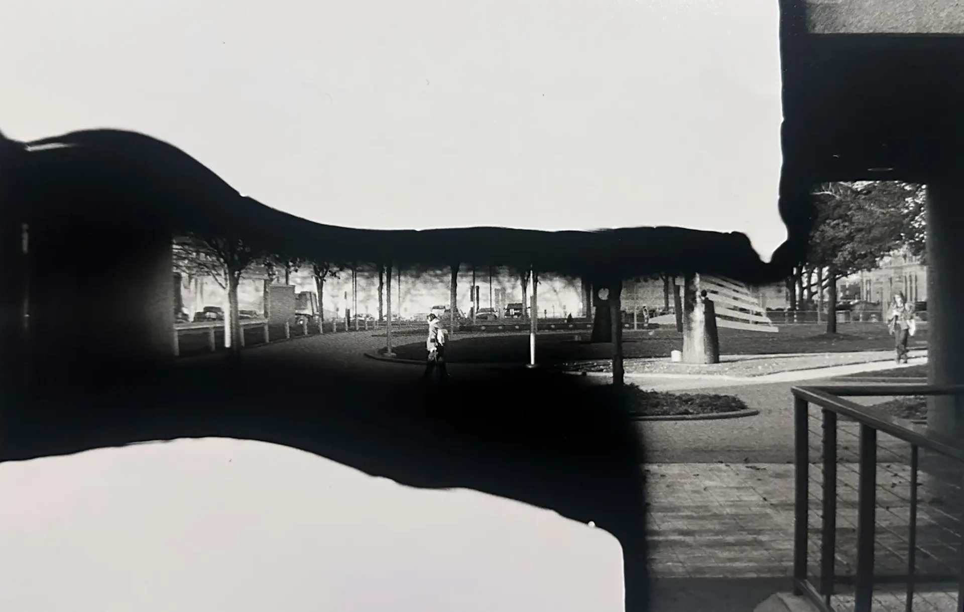 Black and white analog photograph depicting a concept of "speed" through a masked negative.