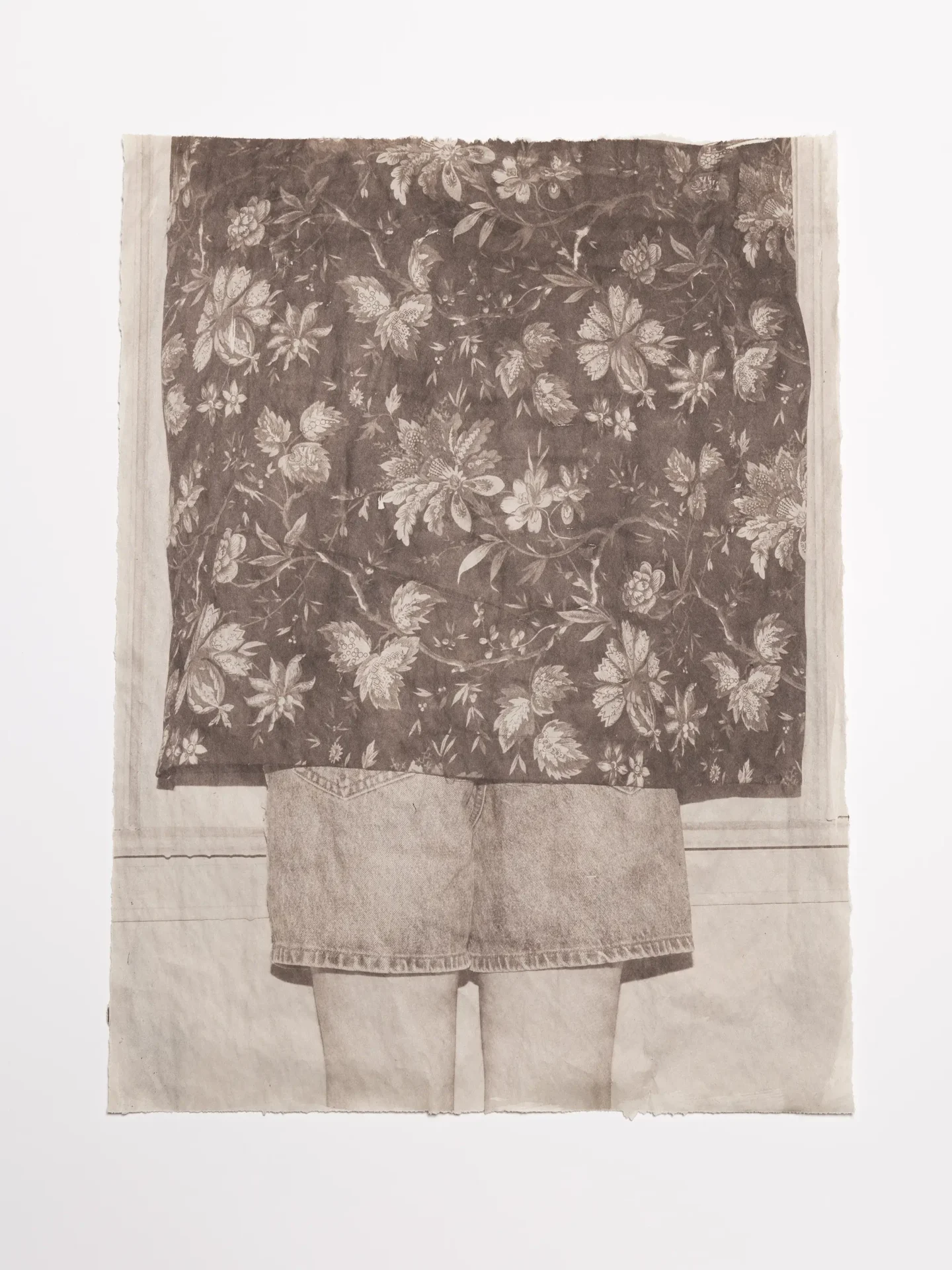 Van Dyke of a floral curtain covering a person wearing denim shorts in front of a window on newsprint.