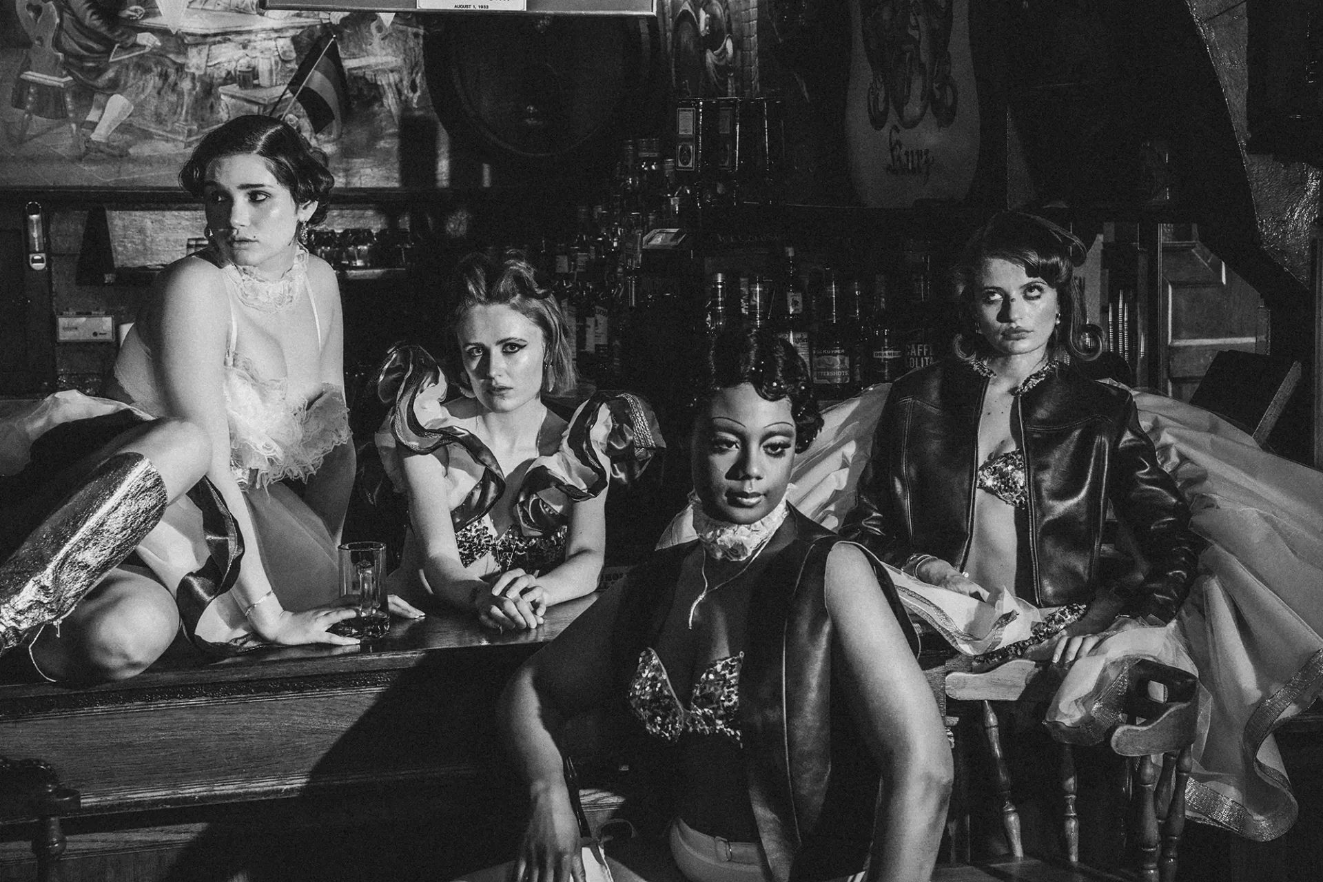 Group of models sitting at a bar