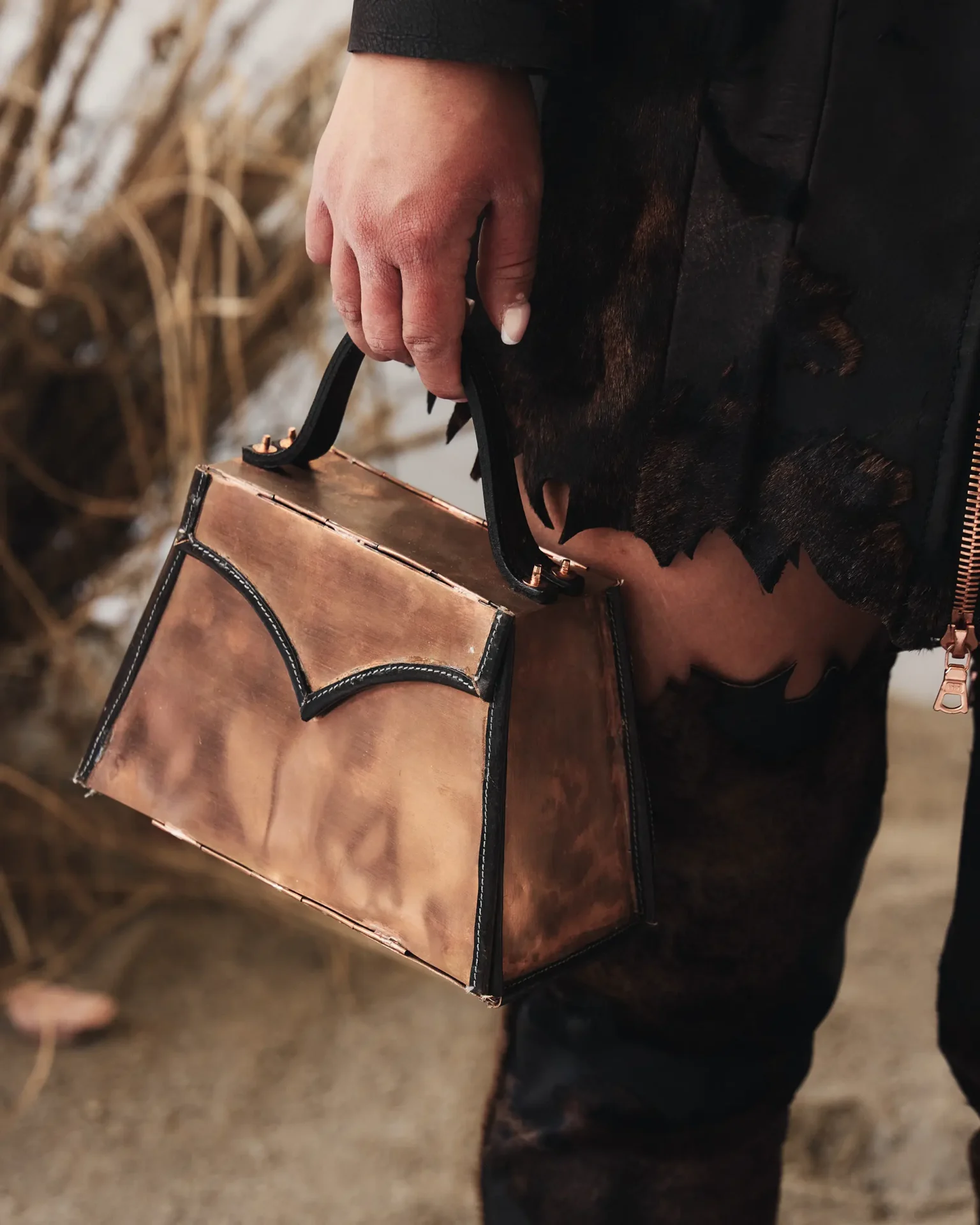 Leather bag with metal hardware