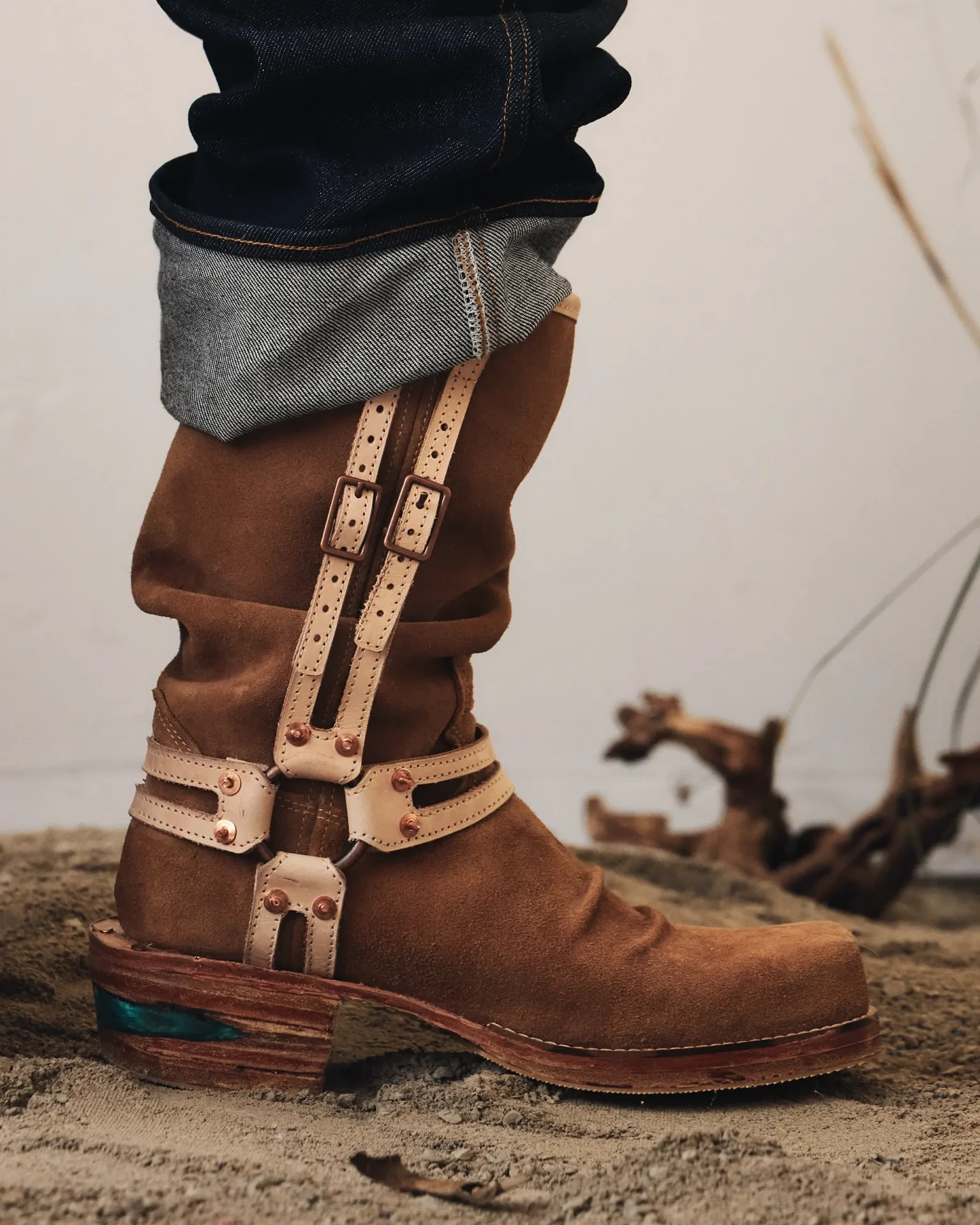 Leather boot with metal hardware