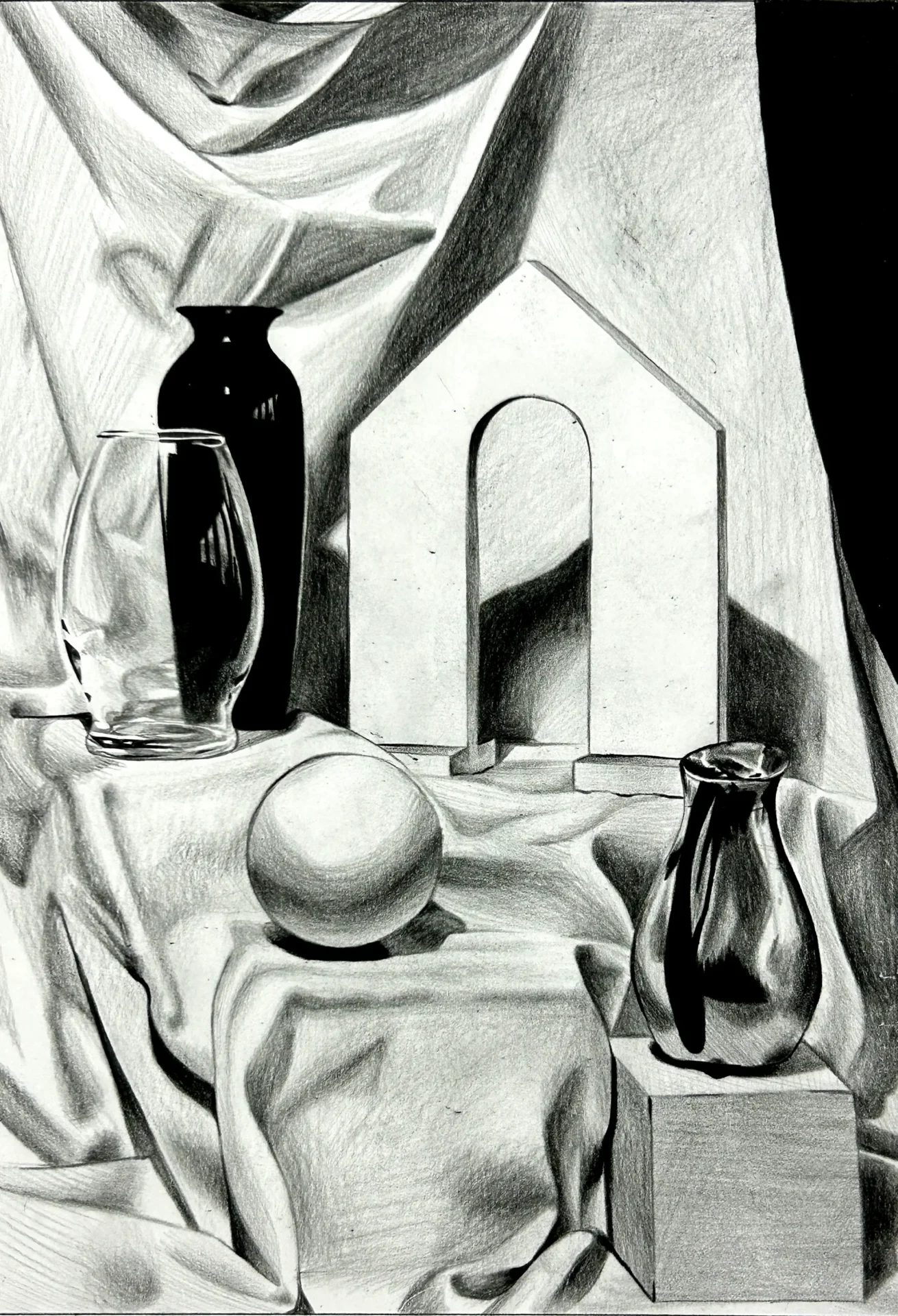 Drawing of a still life with glass and ball on toned paper in charcoal.