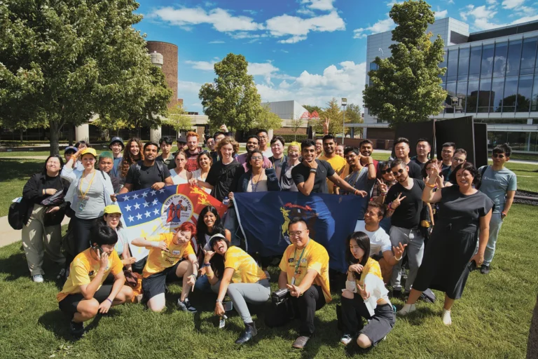 A group of students posing for a picture outside