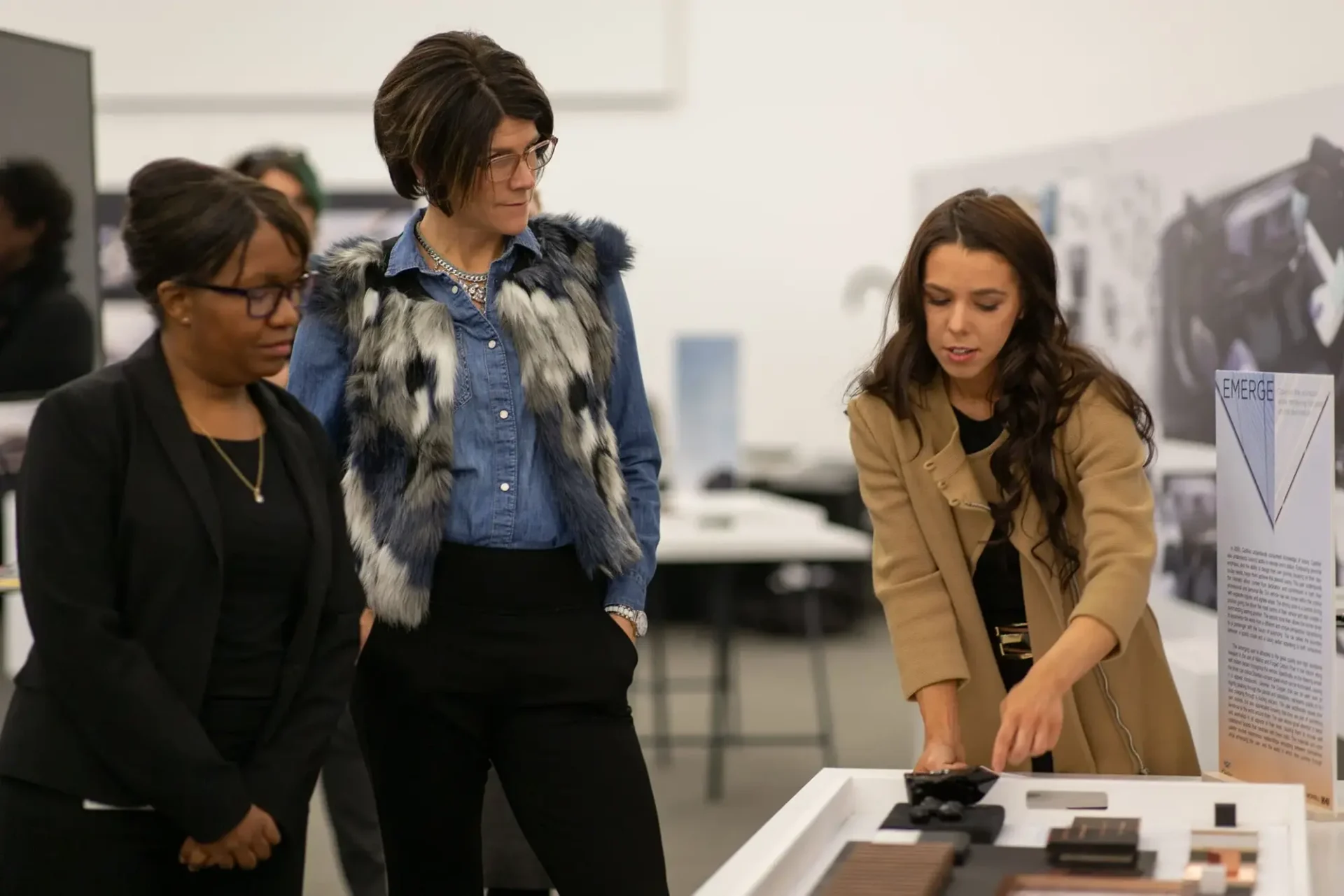 A student showing others their work in a studio space