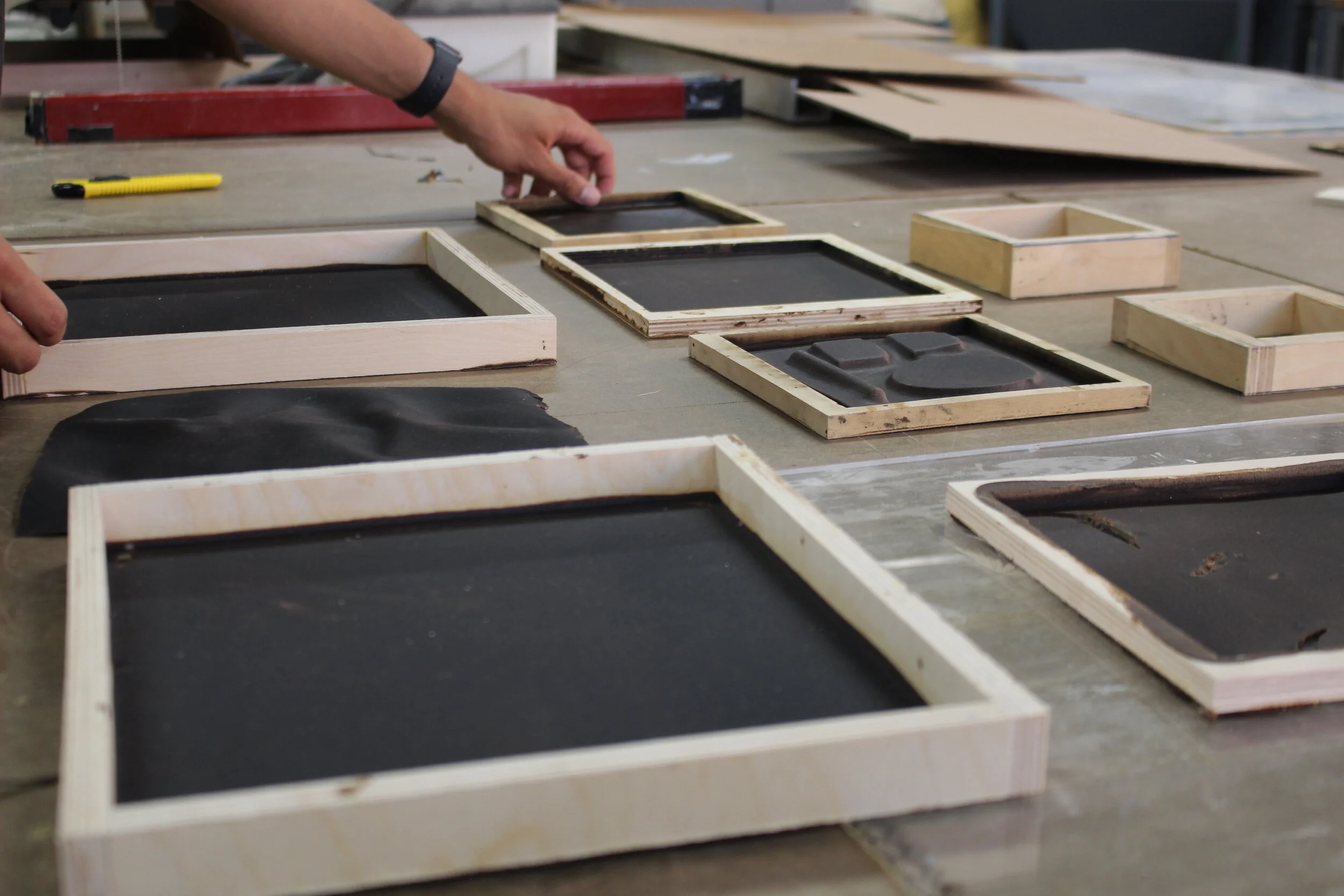 A student organizing and laying out form samples for testing