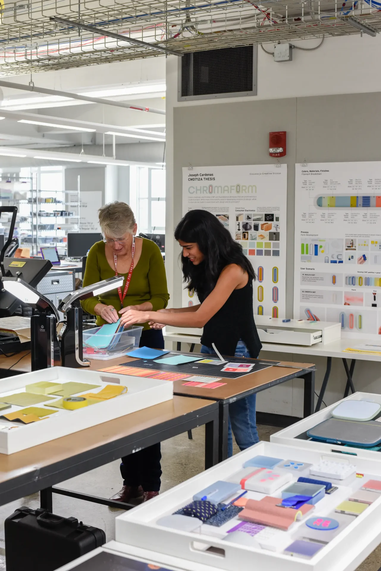 Two students working in a studio space