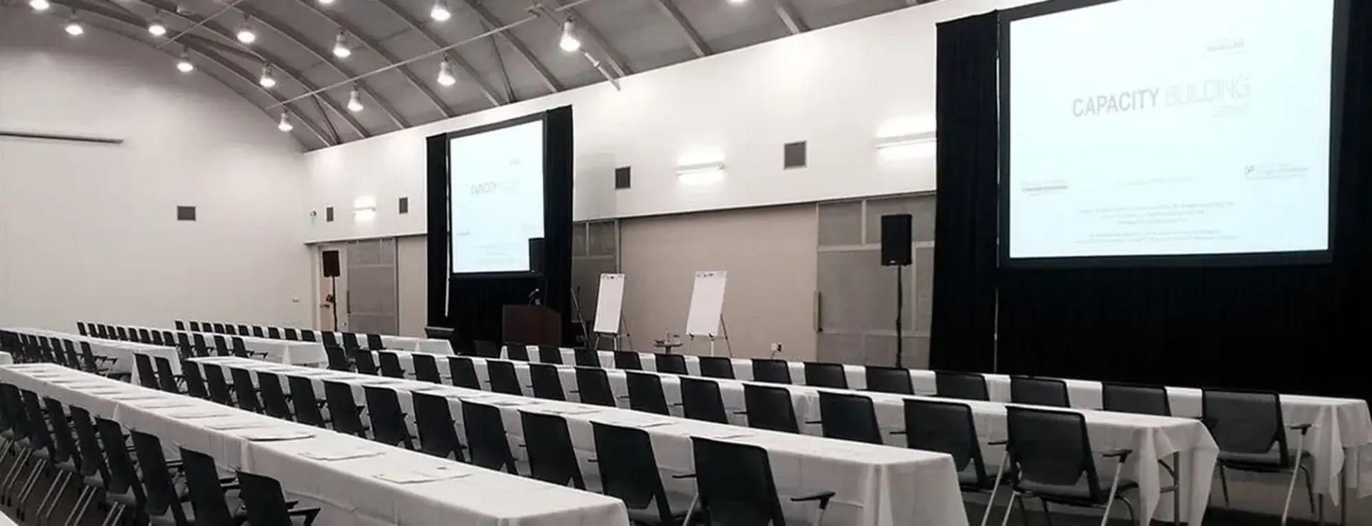 rows of tables set for an event at General Motors Auditorium