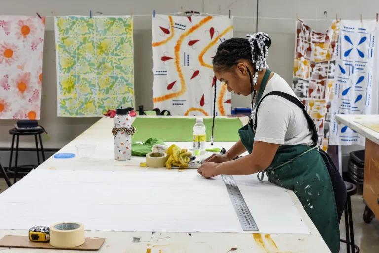 A student working in the Fiber & Textiles studio.