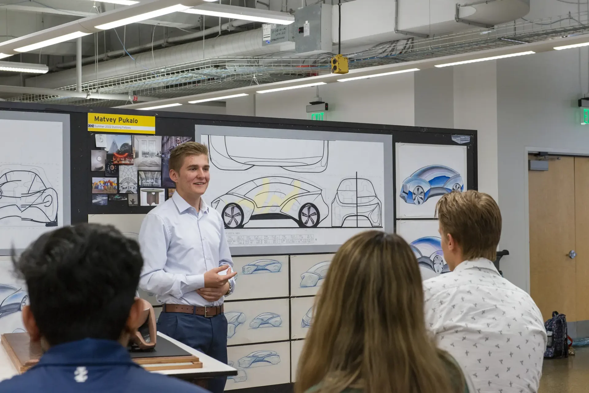 Precollege Transportation Design student presenting their work during a critique.