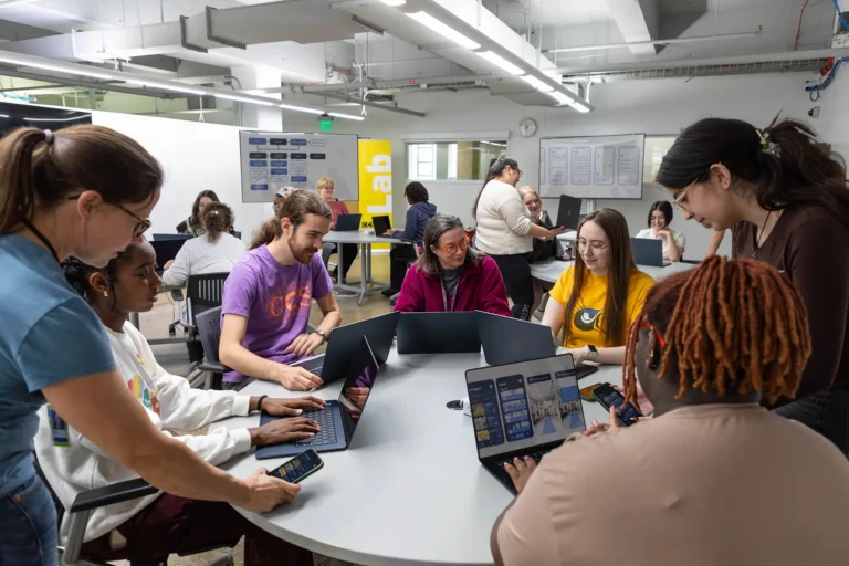 Apple Lab students working on digital design projects.