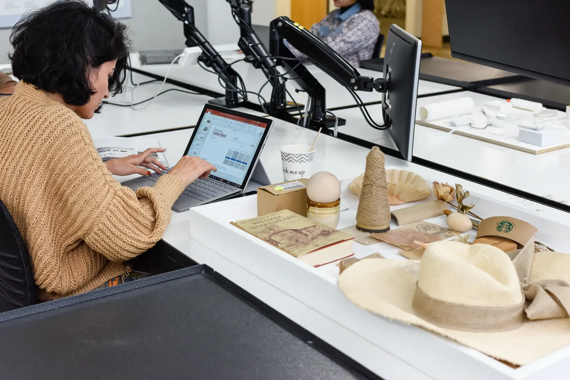 Graduate Studies student working on a project at their desk.