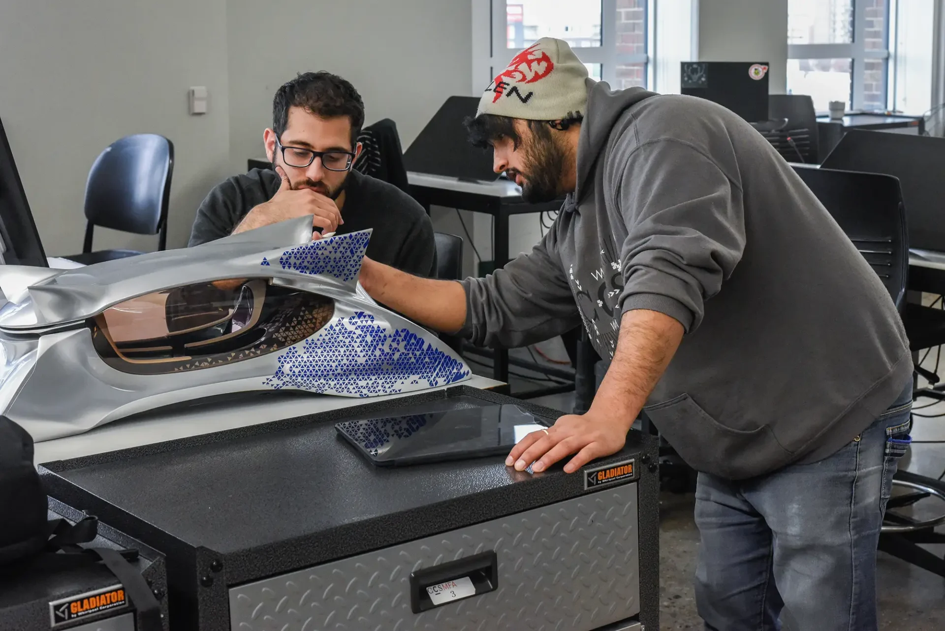 International Transportation Design Graduate students reviewing a project.