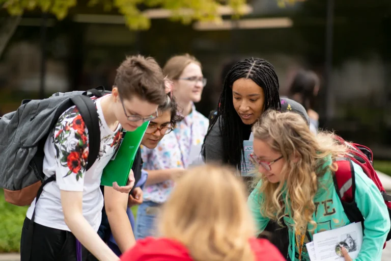 Students on campus learning about opportunities on campus.