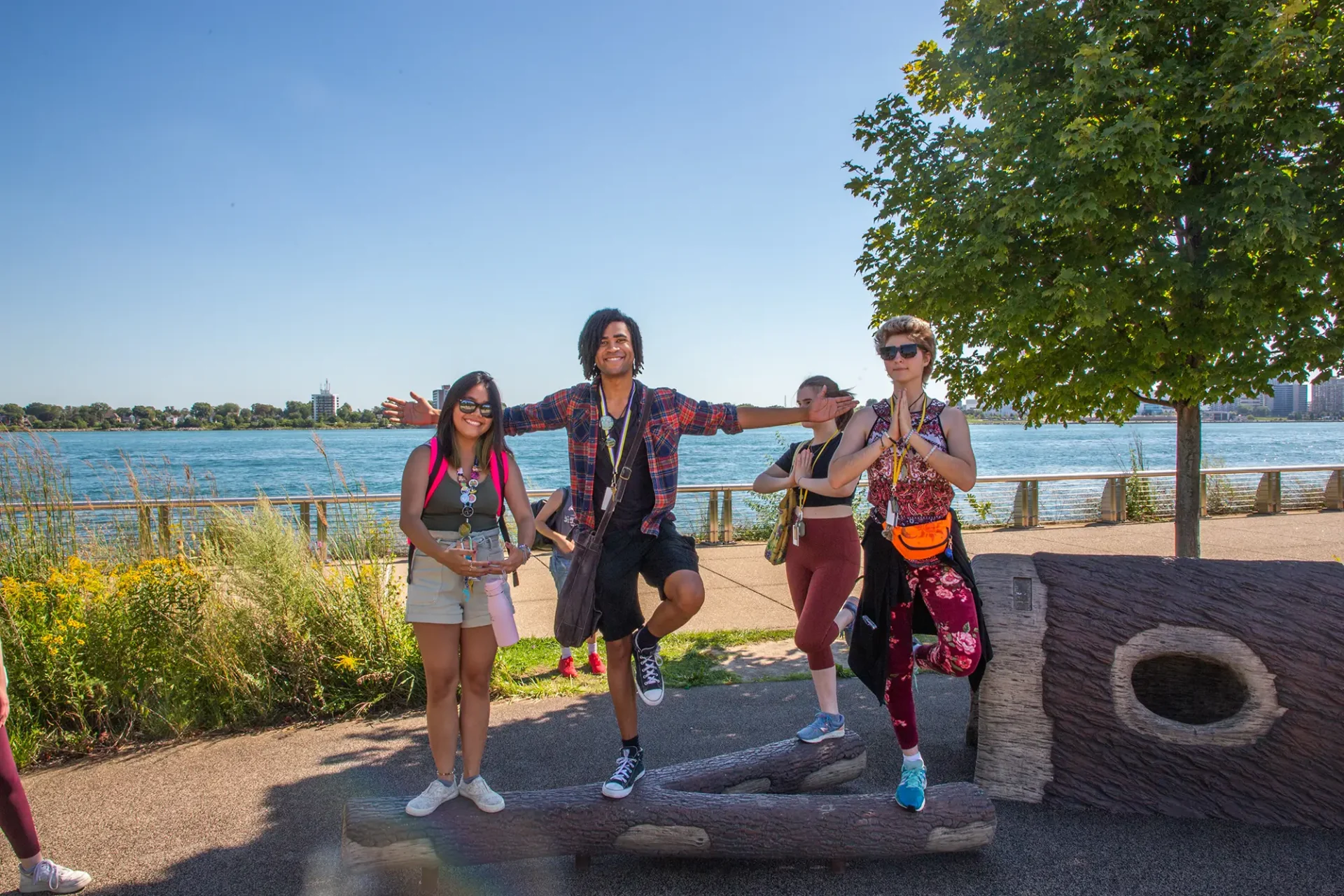 Students happy and peaceful by the Detroit River.