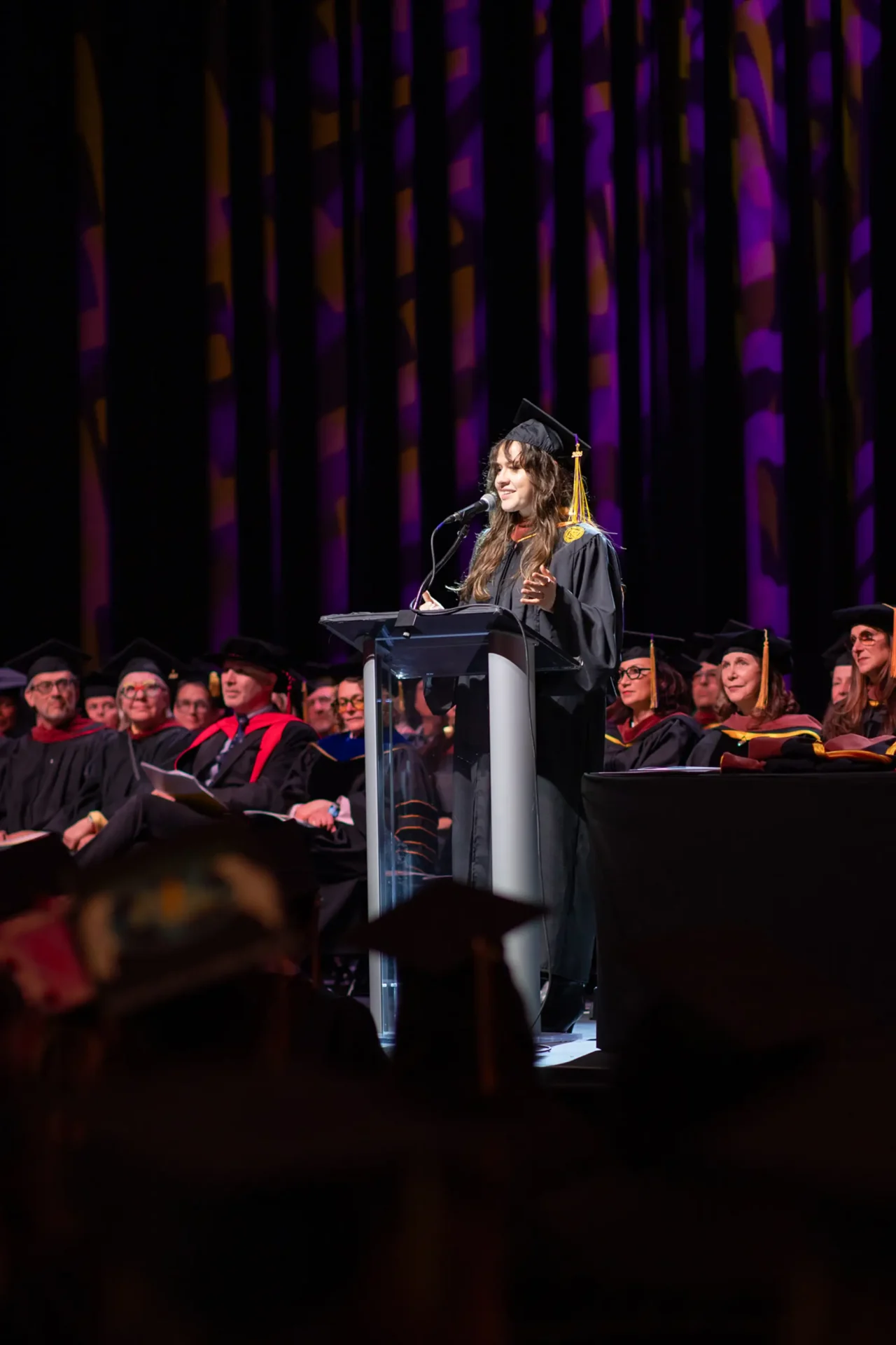 A speaker at the podium during graduation