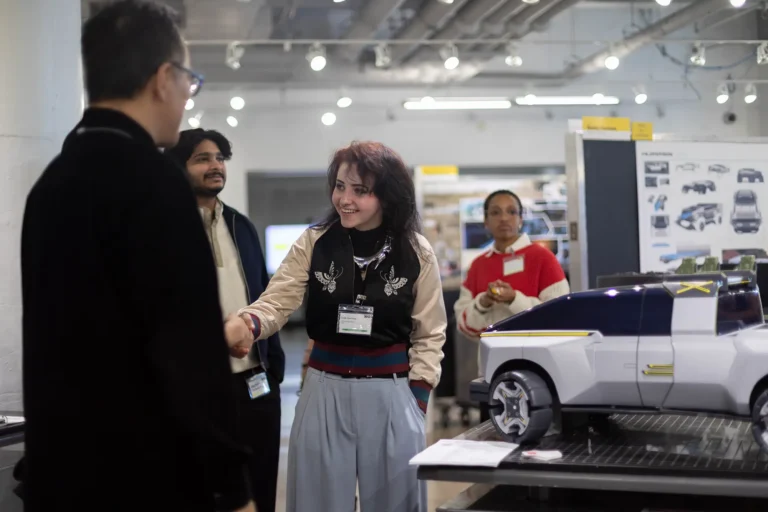 Student meeting an industry professional at a CCS Industry Day event.