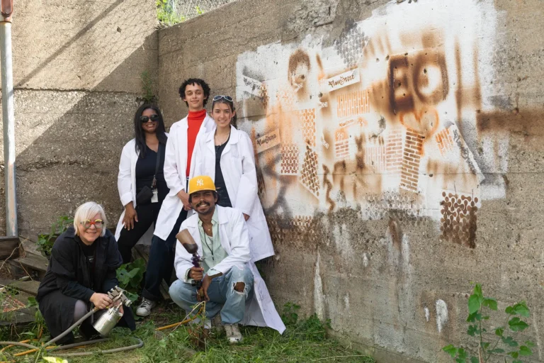 A group of students with their professor and Chair, Melanie McClintock, and Brittany Dabney from Ecosphere Organics
