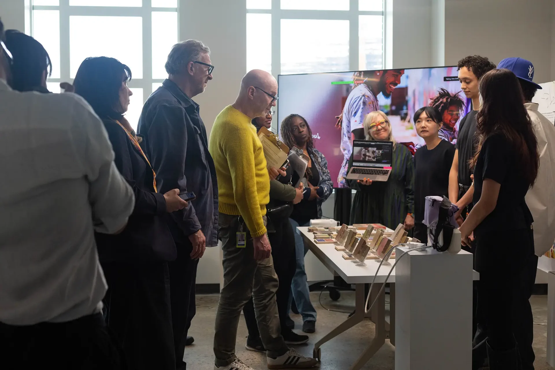 Students presenting their final for a Color & Materials Design sponsored studio with Ecosphere Organics