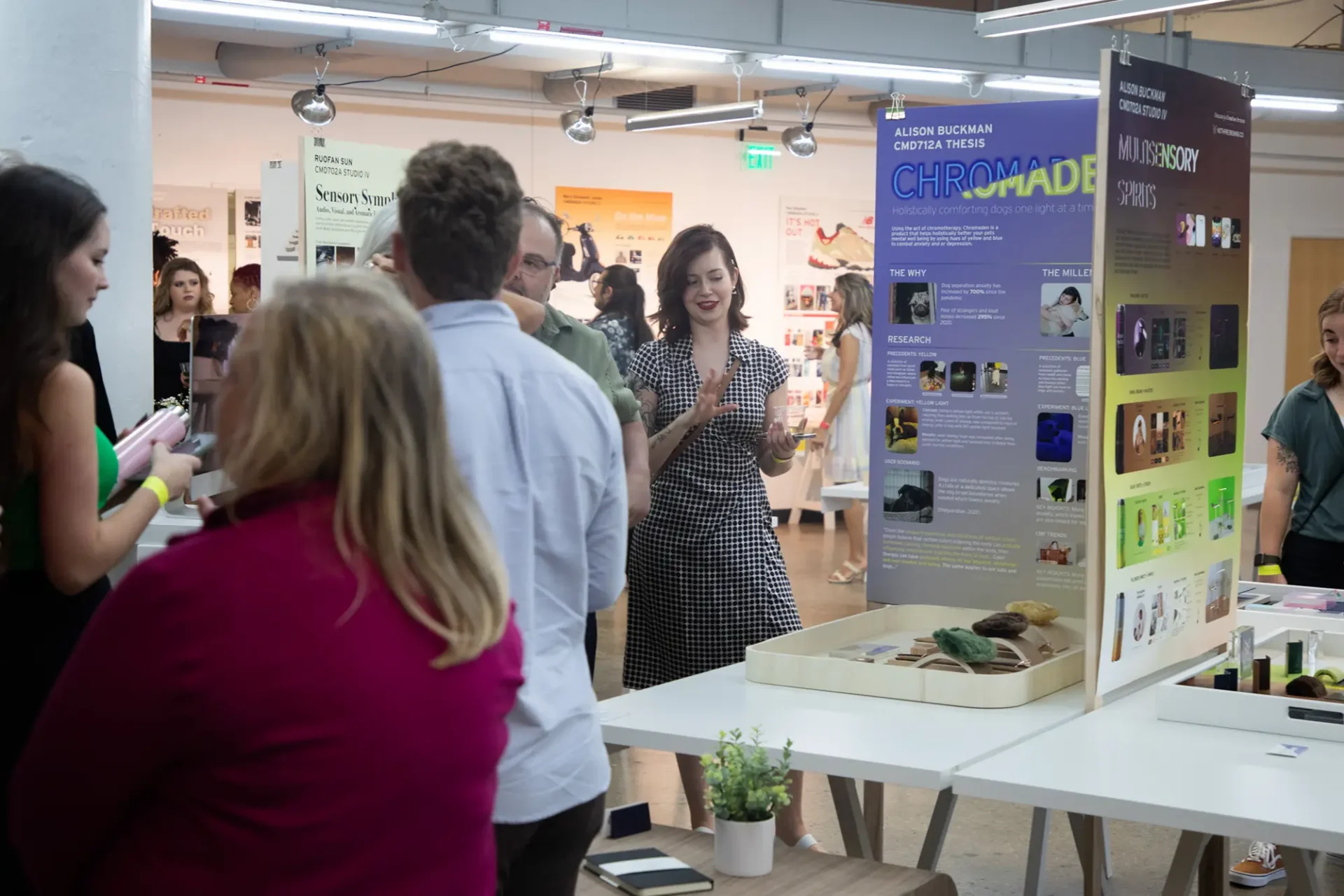 Students and community gathering together at the CCS Student Exhibition.