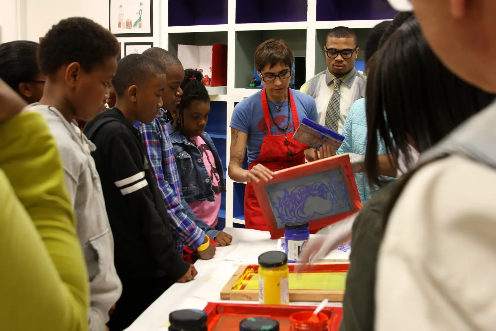 Art Educator n the classroom demonstrating a project to students.