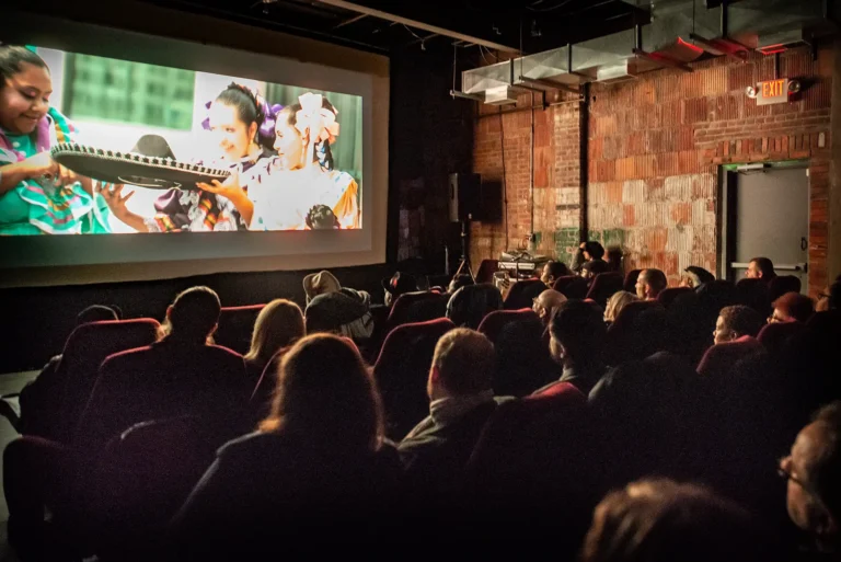 People gallery in a showing room to preview a movie project as part of Kresge Arts in Detroit.