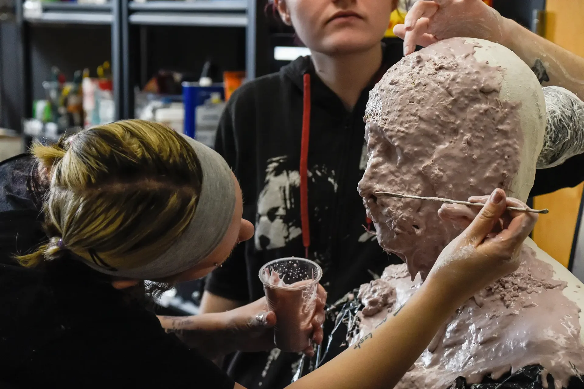 Students applying special FX makeup.
