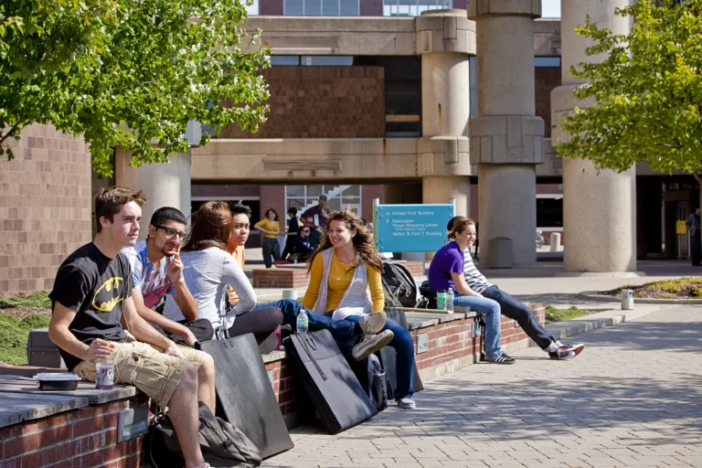 Students sitting outside at the Ford Campus.