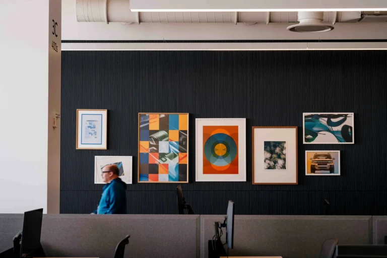 An office space wall with framed artwork