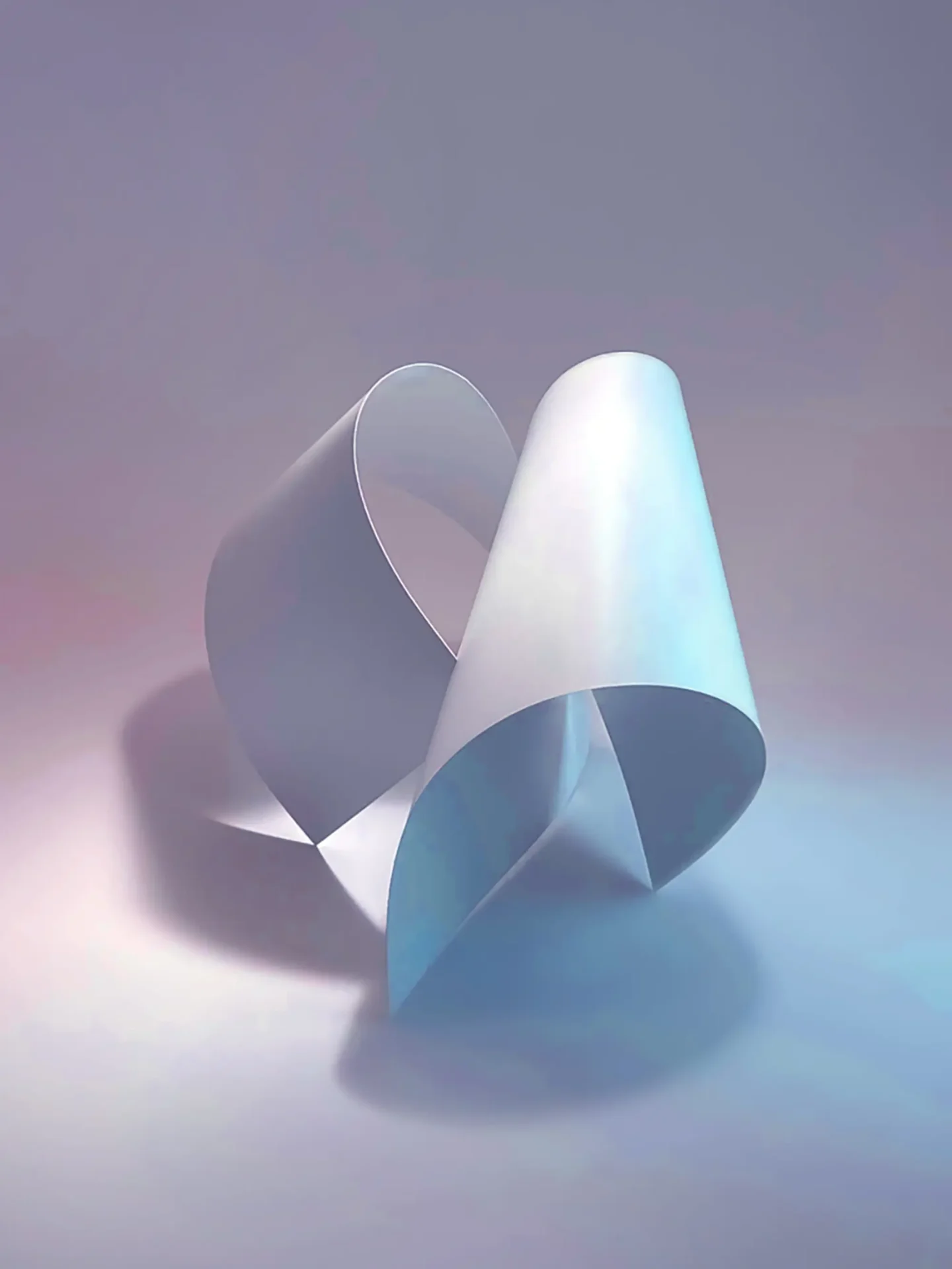 Bent paper creating a looping form with dramatic lighting.