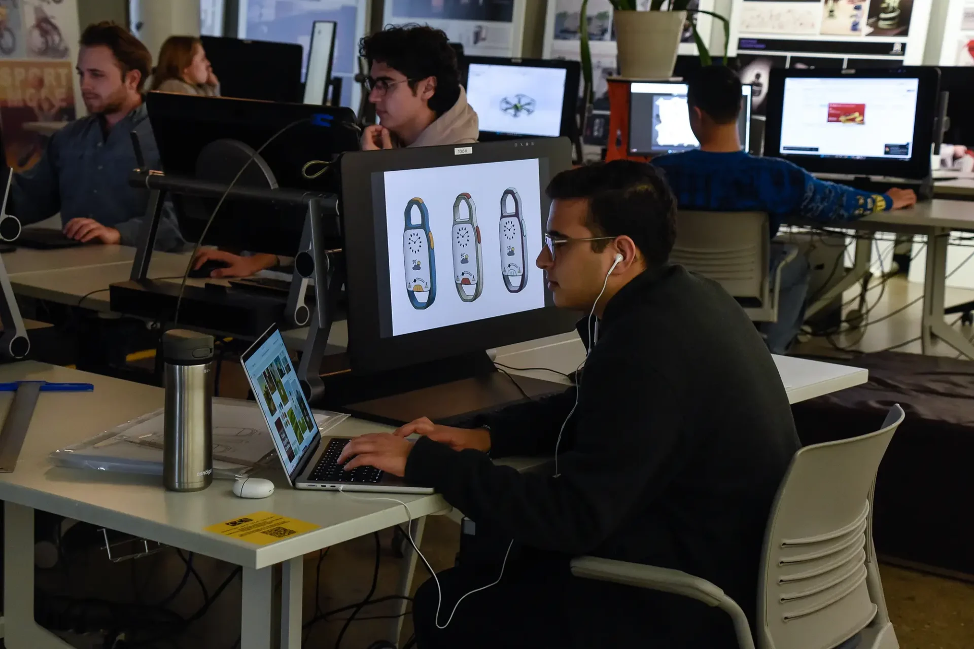 Student working on their project in a computer studio